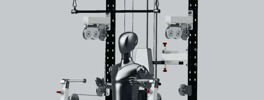 A piece of adaptive gym equipment designed for wheelchair users, featuring adjustable pulleys and a seated mannequin demonstrating its use.